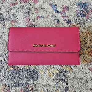 Like new!  Used one.   Michael Kors Wallet